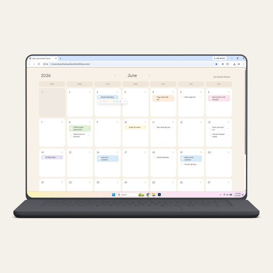 Monthly planner with colored tasks displayed on a laptop screen.